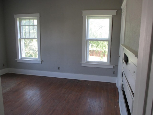 312 Union St, Joliet, IL 60433 - unfurnished room with plenty of natural light, dark wood-style floors, and baseboards