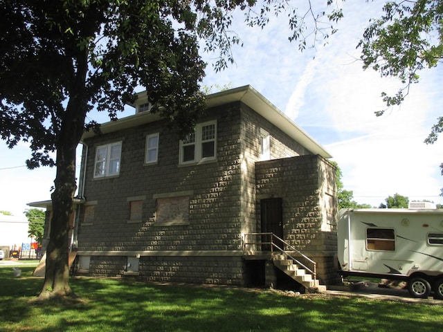 312 Union St, Joliet, IL 60433 - view of home's exterior featuring a lawn