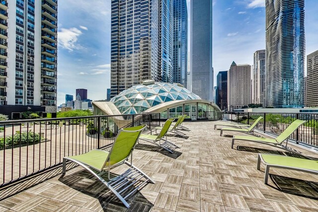 400 E Randolph St Unit 3321, Chicago, IL 60601 - view of patio featuring a skyline view and a balcony