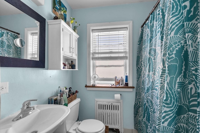 530 Michigan Ave Unit 3E, Evanston, IL 60202 - bathroom featuring radiator heating unit and a sink
