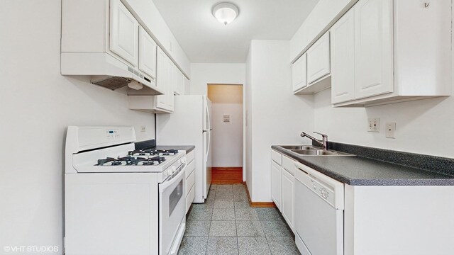 6316 N Paulina St Unit 3D, Chicago, IL 60660 - kitchen featuring white appliances, a sink, dark countertops, white cabinets, and custom exhaust hood