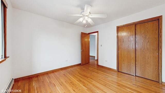 6316 N Paulina St Unit 3D, Chicago, IL 60660 - unfurnished bedroom with a baseboard radiator, light wood-style flooring, baseboards, a closet, and ceiling fan