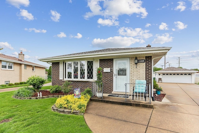 11025 S Kolmar Ave, Oak Lawn, IL 60453 - view of front facade with brick siding, an outbuilding, a front yard, and a detached garage