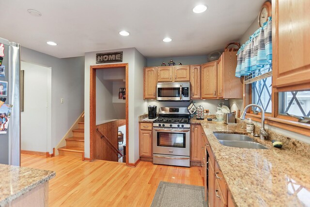 11025 S Kolmar Ave, Oak Lawn, IL 60453 - kitchen featuring appliances with stainless steel finishes, a sink, light wood-type flooring, light stone countertops, and recessed lighting