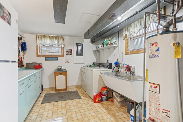11025 S Kolmar Ave, Oak Lawn, IL 60453 - laundry room featuring water heater, independent washer and dryer, healthy amount of natural light, and cabinet space