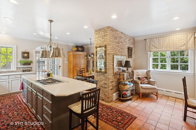 539 N E Ave, Oak Park, IL 60302 - kitchen with healthy amount of natural light, stainless steel gas cooktop, light countertops, ornamental molding, and recessed lighting