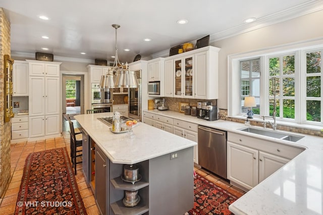 539 N E Ave, Oak Park, IL 60302 - kitchen with appliances with stainless steel finishes, ornamental molding, open shelves, backsplash, and a kitchen island