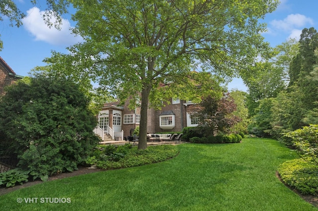 539 N E Ave, Oak Park, IL 60302 - view of grassy yard featuring a patio area and entry steps