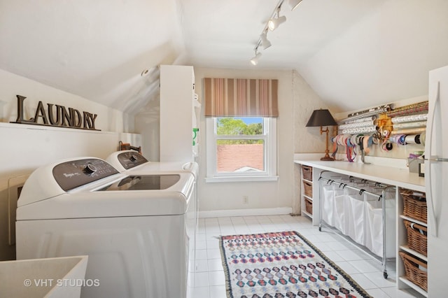 539 N E Ave, Oak Park, IL 60302 - laundry area with washing machine and clothes dryer, rail lighting, and light tile patterned floors