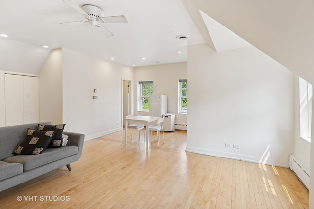 539 N E Ave, Oak Park, IL 60302 - living room featuring light wood-style floors, a baseboard radiator, a ceiling fan, recessed lighting, and a baseboard heating unit