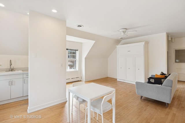 539 N E Ave, Oak Park, IL 60302 - additional living space featuring baseboard heating, light wood-type flooring, a ceiling fan, recessed lighting, and vaulted ceiling