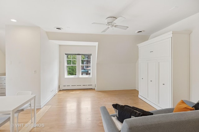 539 N E Ave, Oak Park, IL 60302 - living area featuring a baseboard heating unit, ceiling fan, light wood-style floors, and recessed lighting