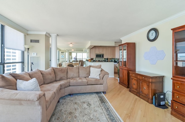 405 N Wabash Ave Unit 3403, Chicago, IL 60611 - living room with light wood-style flooring, ornamental molding, and ornate columns