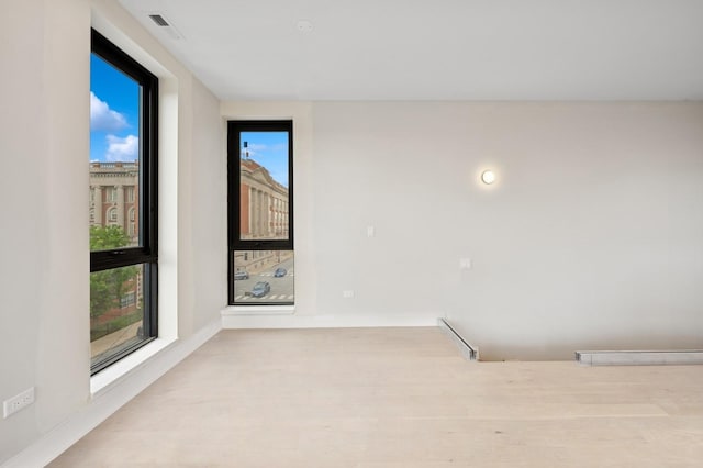 222 S Oakley Blvd Unit 3, Chicago, IL 60612 - spare room with wood finished floors and baseboards