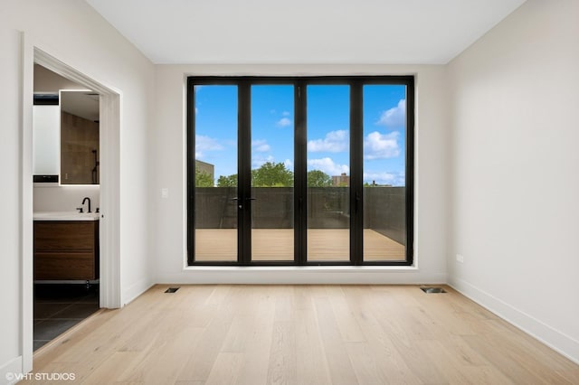222 S Oakley Blvd Unit 3, Chicago, IL 60612 - spare room with light wood finished floors and baseboards