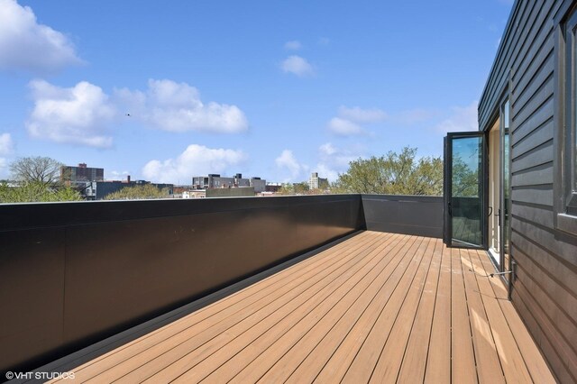 222 S Oakley Blvd Unit 3, Chicago, IL 60612 - wooden terrace with a city view