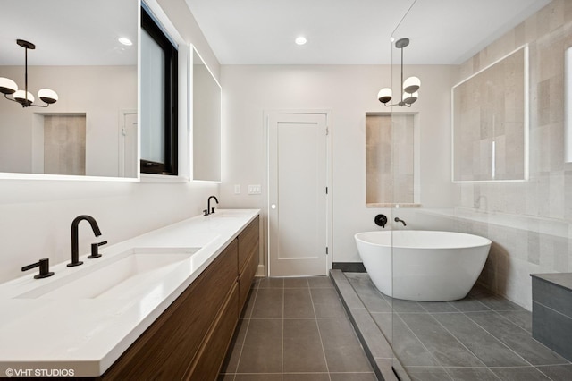 222 S Oakley Blvd Unit 3, Chicago, IL 60612 - full bathroom featuring a freestanding tub, double vanity, tile patterned flooring, a chandelier, and recessed lighting