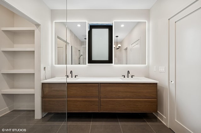 222 S Oakley Blvd Unit 3, Chicago, IL 60612 - full bath featuring double vanity, tile patterned flooring, built in shelves, and a walk in shower