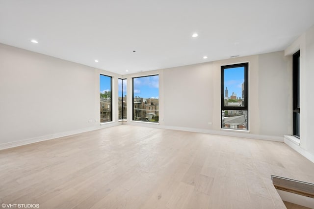 222 S Oakley Blvd Unit 3, Chicago, IL 60612 - spare room featuring light wood-style flooring, recessed lighting, and baseboards