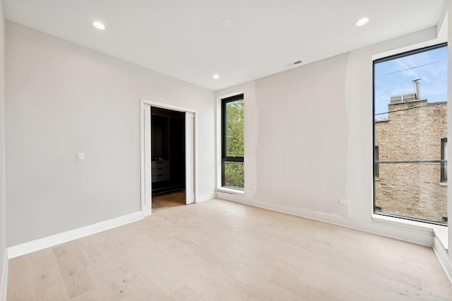 222 S Oakley Blvd Unit 3, Chicago, IL 60612 - empty room with wood finished floors, baseboards, and recessed lighting