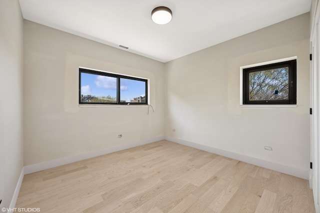 222 S Oakley Blvd Unit 3, Chicago, IL 60612 - unfurnished room with light wood-style floors, plenty of natural light, and baseboards
