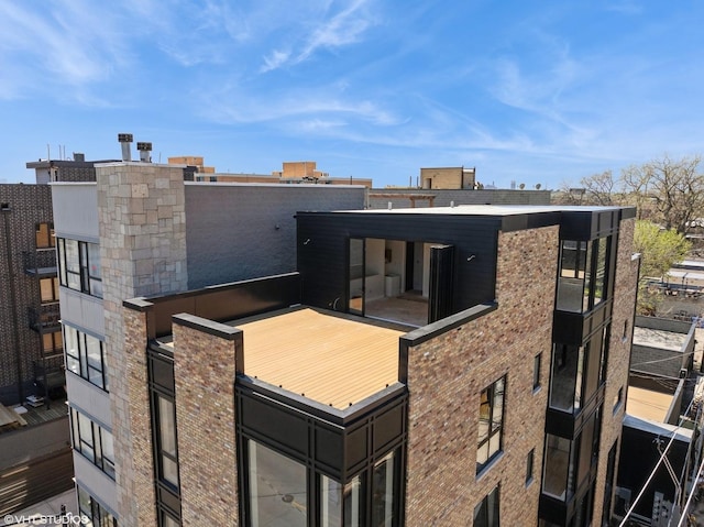 222 S Oakley Blvd Unit 3, Chicago, IL 60612 - rear view of property with a balcony and brick siding