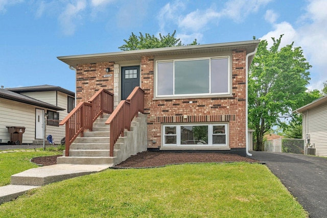 18024 Birch Ave, Country Club Hills, IL 60478 - view of front of home featuring a front lawn, brick siding, and driveway