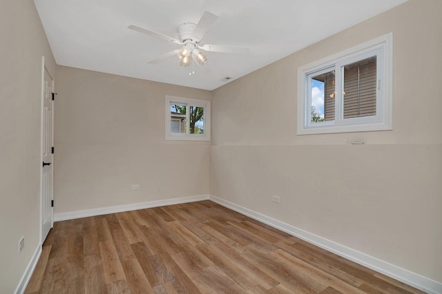 18024 Birch Ave, Country Club Hills, IL 60478 - unfurnished room with wood finished floors, baseboards, and a ceiling fan