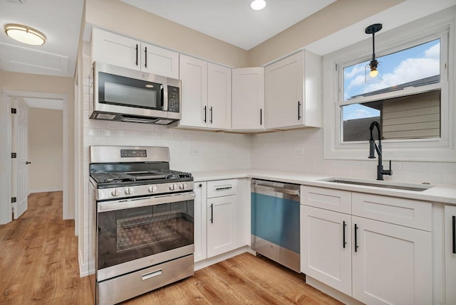 18024 Birch Ave, Country Club Hills, IL 60478 - kitchen featuring stainless steel appliances, a sink, white cabinets, and backsplash