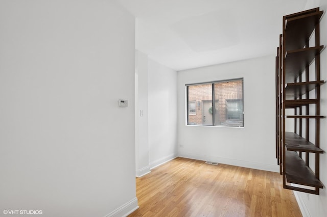 3759 N Kenmore Ave Unit A, Chicago, IL 60613 - spare room featuring light wood-style flooring and baseboards
