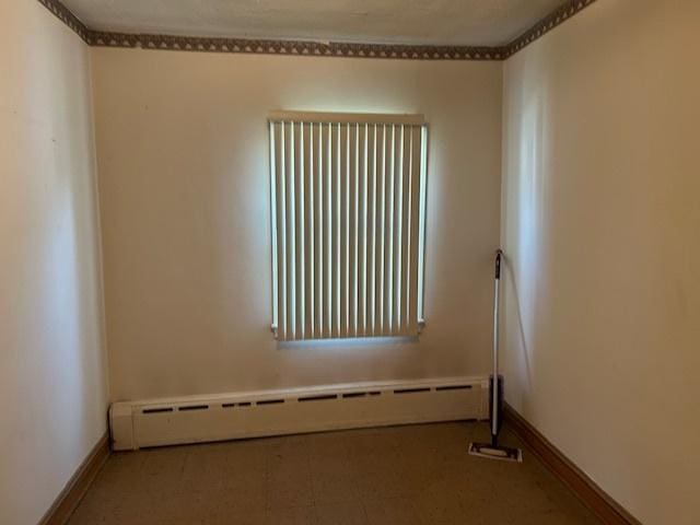 3832 N Nora Ave, Chicago, IL 60634 - empty room with baseboard heating and baseboards