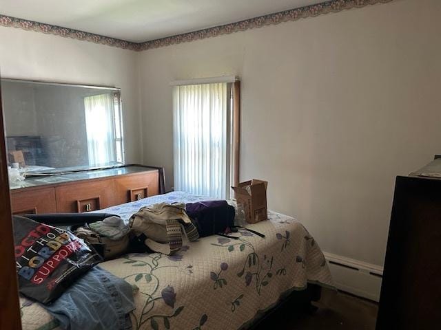 3832 N Nora Ave, Chicago, IL 60634 - bedroom featuring a baseboard heating unit