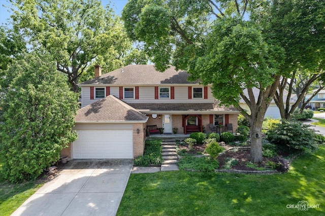 6382 Twin Oaks Ln, Lisle, IL 60532 - view of front of house with concrete driveway, covered porch, a front yard, brick siding, and an attached garage