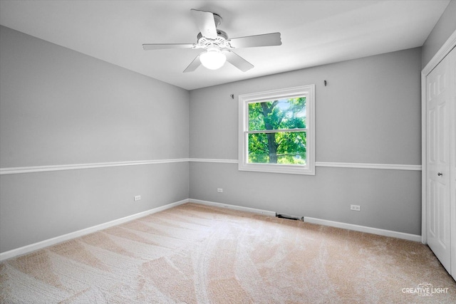 6382 Twin Oaks Ln, Lisle, IL 60532 - unfurnished bedroom featuring a closet, carpet, and a ceiling fan