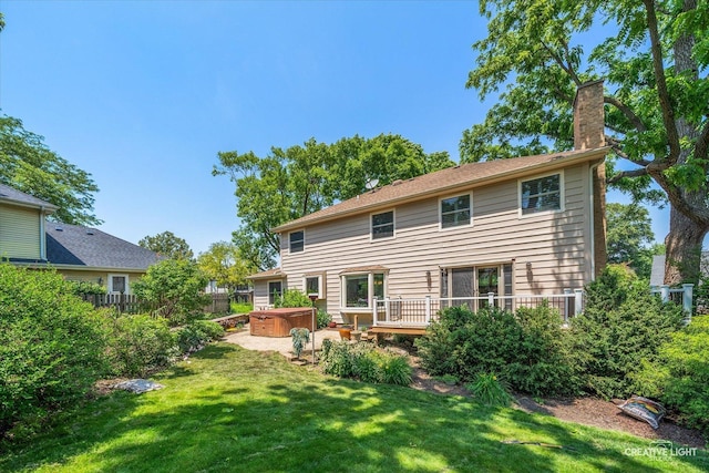 6382 Twin Oaks Ln, Lisle, IL 60532 - back of property featuring a hot tub, a chimney, and a wooden deck