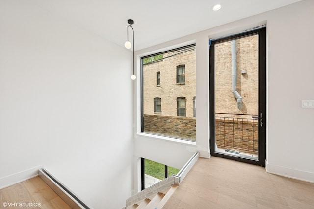 220 S Oakley Blvd, Chicago, IL 60612 - doorway with wood finished floors, baseboards, and recessed lighting