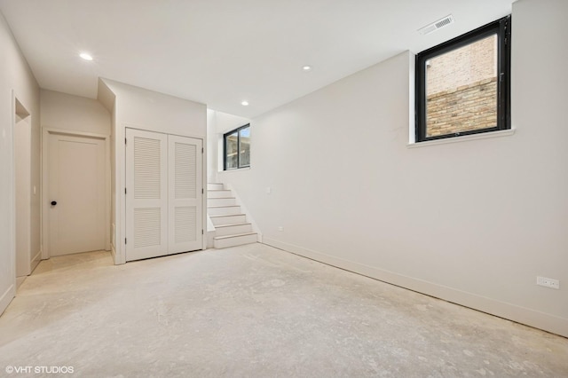 220 S Oakley Blvd, Chicago, IL 60612 - unfurnished bedroom with multiple windows, concrete floors, baseboards, and recessed lighting