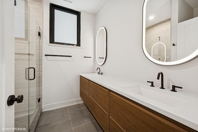 220 S Oakley Blvd, Chicago, IL 60612 - bathroom featuring double vanity, a stall shower, tile patterned floors, and baseboards