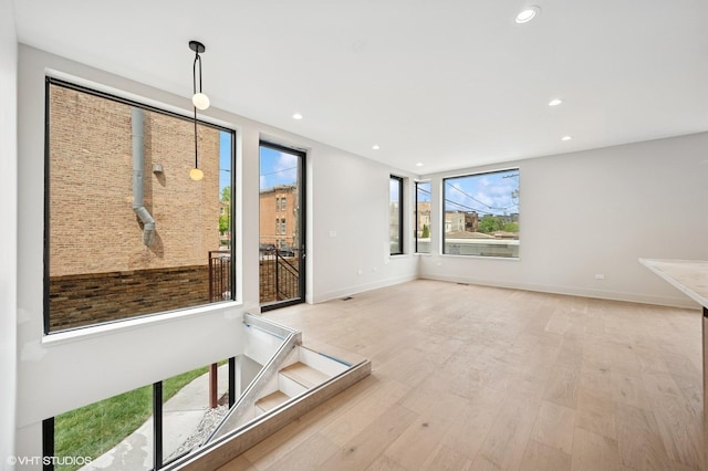 220 S Oakley Blvd, Chicago, IL 60612 - empty room with plenty of natural light, recessed lighting, light wood-style floors, and baseboards