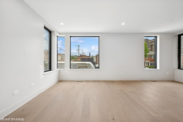 220 S Oakley Blvd, Chicago, IL 60612 - unfurnished room featuring light wood-style floors, healthy amount of natural light, baseboards, and recessed lighting