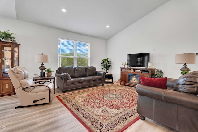 8716 Pebble Creek Ct, Wonder Lake, IL 60097 - living room featuring light wood-style flooring, vaulted ceiling, and recessed lighting