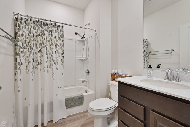 8716 Pebble Creek Ct, Wonder Lake, IL 60097 - bathroom with shower / tub combo, toilet, vanity, and wood finished floors