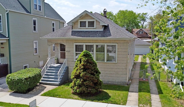 4327 W Henderson St, Chicago, IL 60641 - bungalow featuring roof with shingles