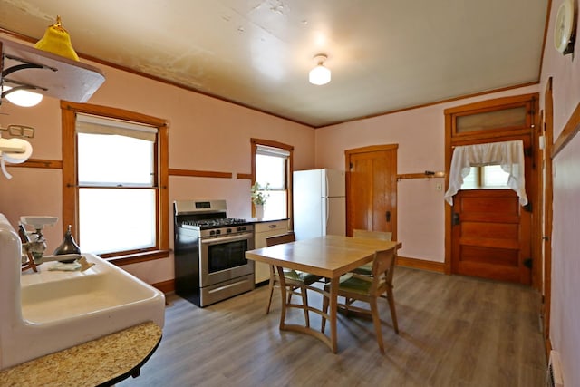 4327 W Henderson St, Chicago, IL 60641 - kitchen featuring gas stove, freestanding refrigerator, light wood-type flooring, a sink, and baseboards