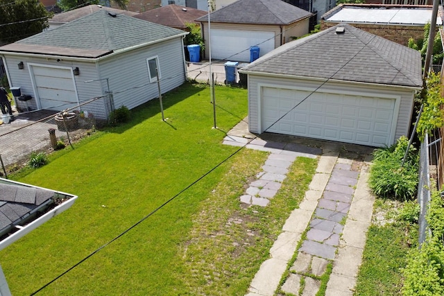 4327 W Henderson St, Chicago, IL 60641 - view of yard featuring a garage