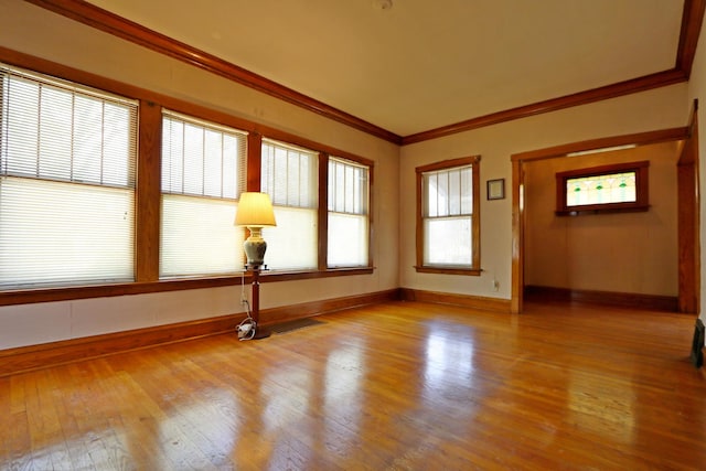 4327 W Henderson St, Chicago, IL 60641 - spare room with crown molding, wood finished floors, and baseboards