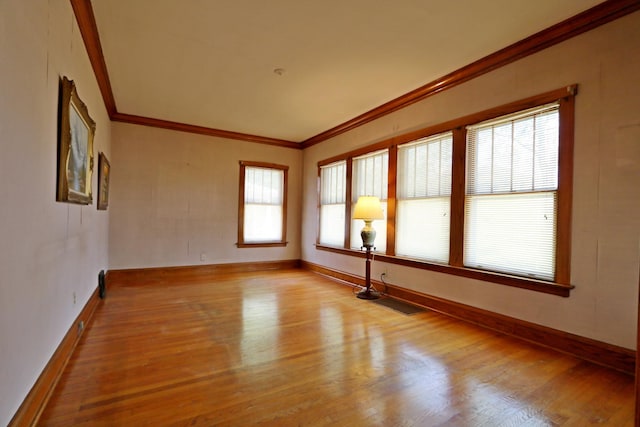 4327 W Henderson St, Chicago, IL 60641 - unfurnished room featuring crown molding, wood finished floors, and baseboards