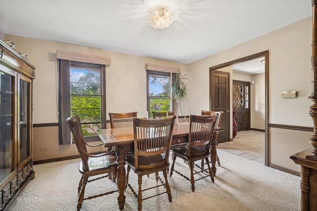 4216 Yorkshire Ln, Northbrook, IL 60062 - dining space with baseboards, plenty of natural light, and light carpet