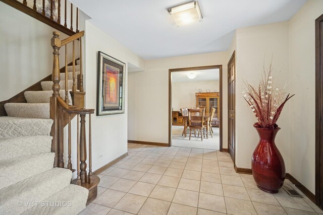 4216 Yorkshire Ln, Northbrook, IL 60062 - entrance foyer with stairway, baseboards, and light tile patterned floors