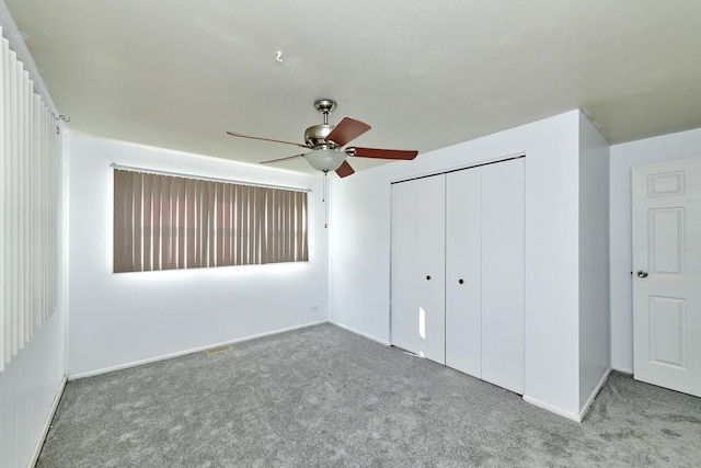 1613 Hartmann Dr, Schaumburg, IL 60193 - unfurnished bedroom featuring carpet floors, a closet, baseboards, and ceiling fan